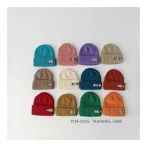 Factory sold childrens woolen hat with smiley face and small leather label simple colorful knitted hat stylish pullover hat childrens woolen hat