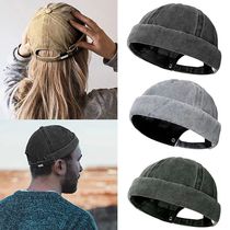 The Docker hat without the tire the beanie the male student