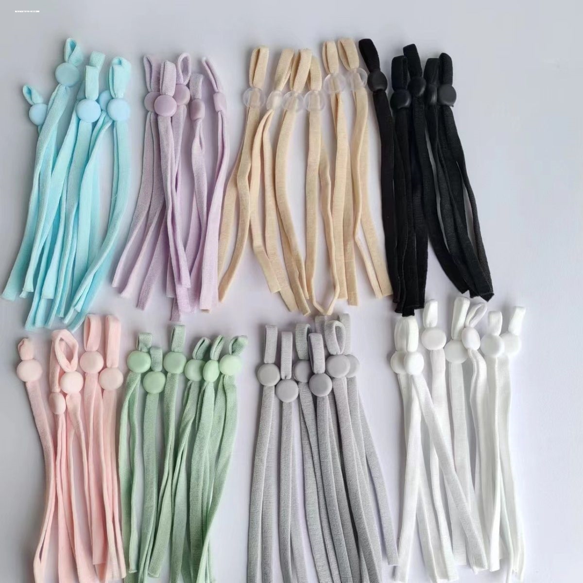 カラフルな丸い調節可能なマスクの耳ひも、滑り止めバックルカード、ゴムバンドマスク、アイマスク、フラットバックル、耳ひも