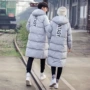 Áo khoác nam mùa đông cotton dài Hàn Quốc cặp vợ chồng sinh viên cotton áo khoác quần áo áo khoác kích thước lớn áo khoác cotton trẻ trung măng tô nam