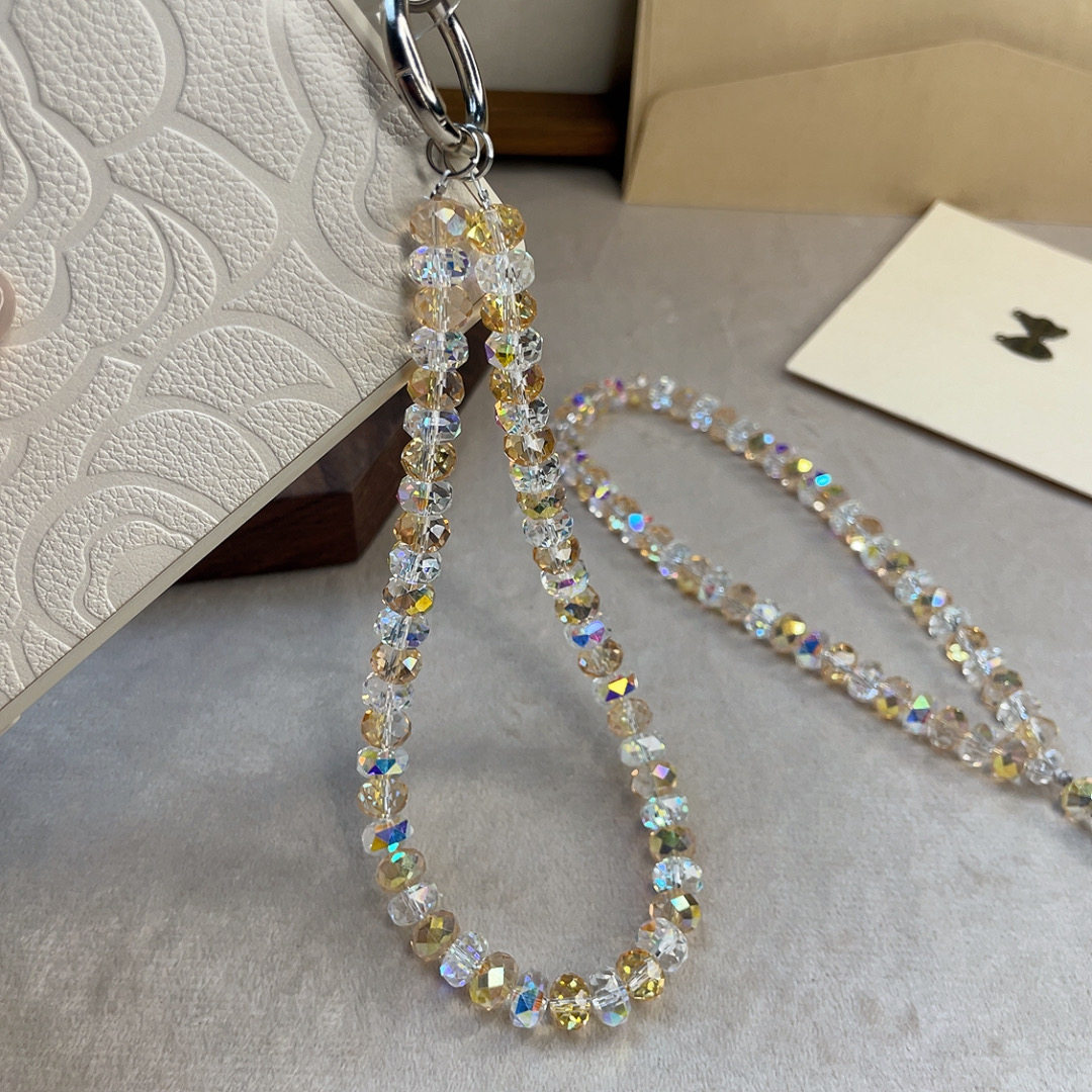High-end, sparkling crystal phone charm, multi-faceted champagne-colored crystal pendant, exquisite crystal bag charm.