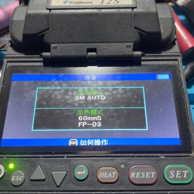 Fujikura 12S Fiber Optic Fusion Splicer. Condition Is as Shown in the Picture. the Machine Has Obvious Signs of Use. Orange Color