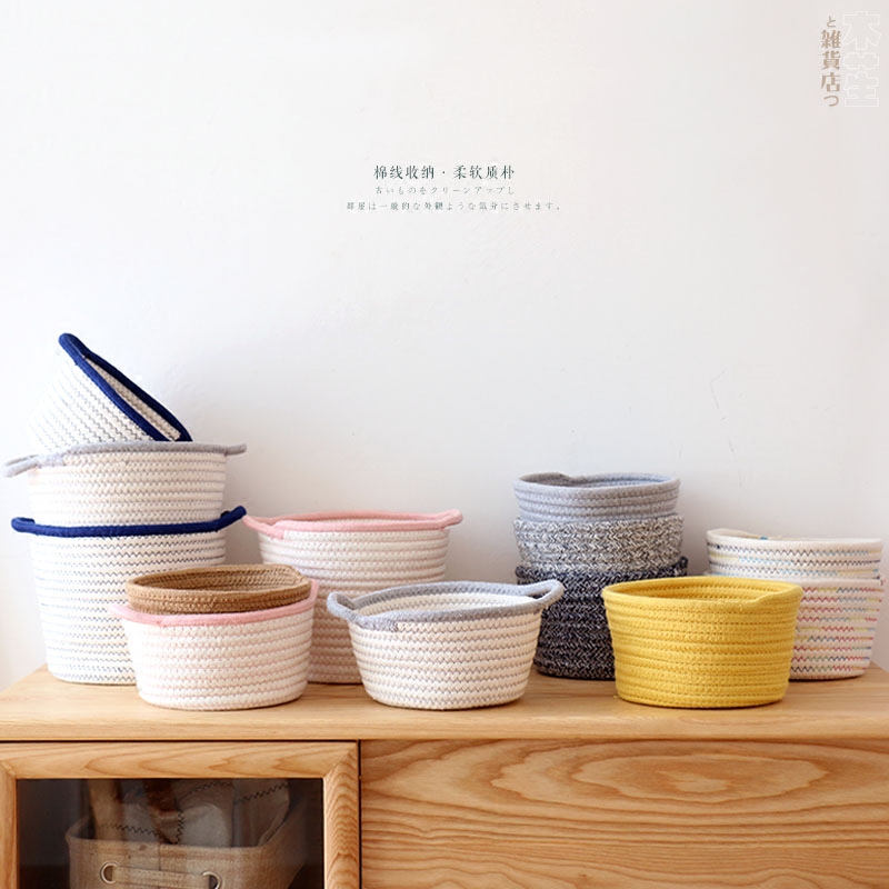 Cornetto -- two pure cotton lines colorful containing basket tabletop debris containing basket round containing box