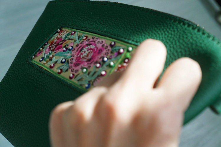 At the end of the day forget the world of Senshu, a lonely forest in the late Qing Republic of China and an old embroidered bag of cow leather purse