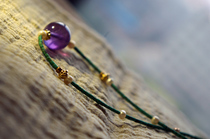 The soft amethyst ball necklace of time