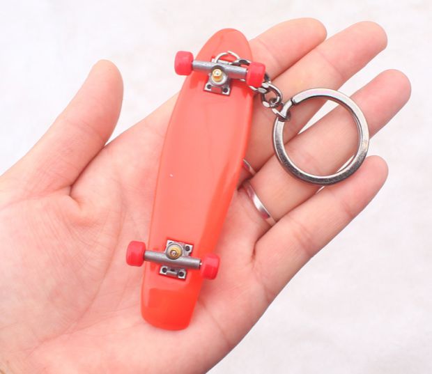 Single cocked hình con cá nhỏ ngón tay ván trượt túi móc treo điện thoại di động mặt dây ngón tay đồ chơi tuổi teen - Trượt băng / Trượt / Thể thao mạo hiểm mũ bảo hiểm xe đạp thể thao