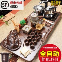 Fully automatic Wujinshi tea set household kung fu tea set four-in-one induction cooker tea table tea ceremony solid wood tea tray