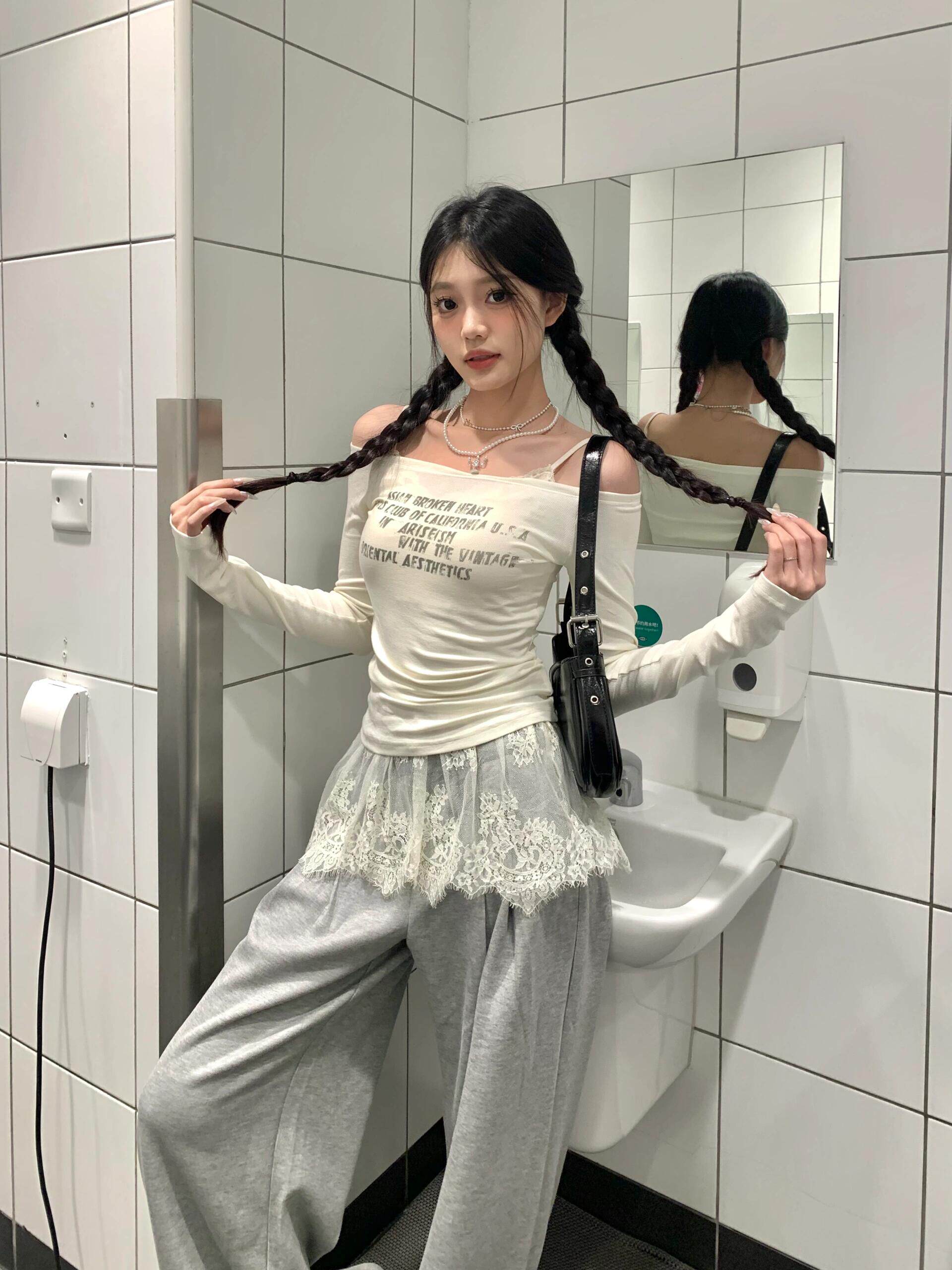 A new early autumn style ballet-inspired mini skirt with a lace-trimmed hem and sheer fabric, perfect for layering. The skirt is decorated with a sweet, sheer curtain.