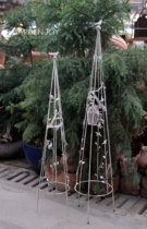 Fall in love with garden climbing cane clematis rose plant stand pastoral iron birds make old potted plants