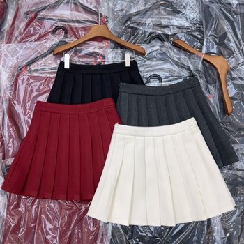 High-End Simple and Age-Reducing Woolen Pleated Short Skirt with Anti-Exposure Button Decoration and Boot Skirt for Winter 2025