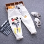Quần jeans bé trai 2019 xuân hè mới cho bé quần trắng chân phiên bản Hàn Quốc cho bé lớn thường mặc quần dài thủy triều - Quần thời trang trẻ em