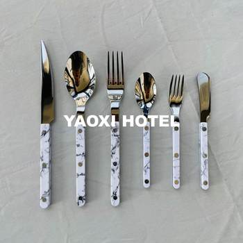 White marble western restaurant knife fork spoon