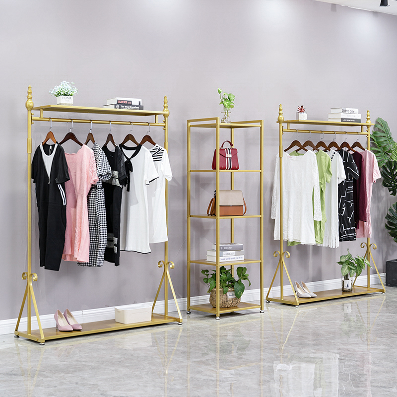 Simple and light luxury hanger Wrought iron gold clothing floor stand Women's store hanger personality creative clothing store display stand