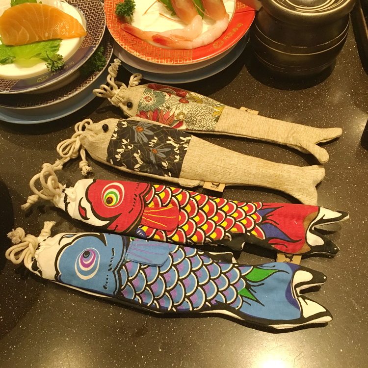 There are cats Japanese souvenir fish-shaped bag wooden spoon chopsticks set and wind carp hand letter wooden tableware