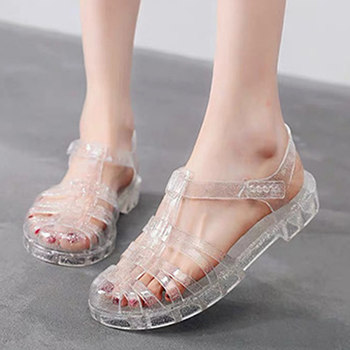 2023 new summer Baotou women's hollow hollow sandals drifting flat crystal beach Roman shoes jelly shoes rain boots
