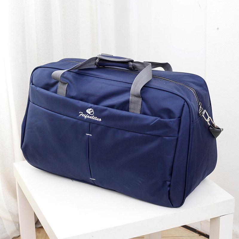 Large capacity water repellent portable travel bag Men's and women's luggage bag Oversized travel bag Travel short business trip waiting bag