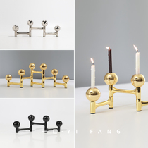 A modern minimalist model room dining table silver black gold candlestick decorations sales office bar accessories