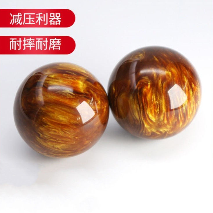 Fitness ball holding ball in hand for the elderly health ball massage ball handball transfer to a couple of practice handball to recover the ball