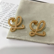 Small Crowd Advanced Geometric Hollowed-out Pearl Earrings Plated 18k Gold Abstract Art Pearl Curvilinear 925 silver pin