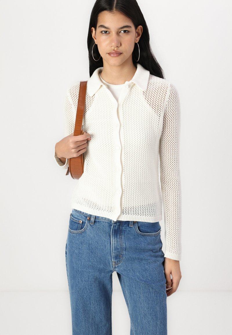 American Department * deer * Women's wear Hollow out knitting Cardigan female Self-cultivation Show thin temperament Lapel tops Cardigan