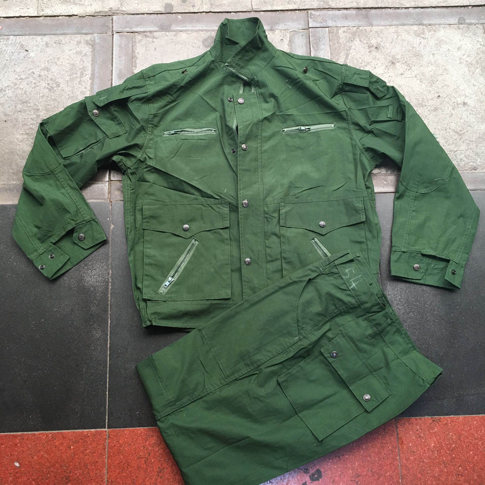 The old fashioned 99 olive green summer combat training suit does a lot of work.