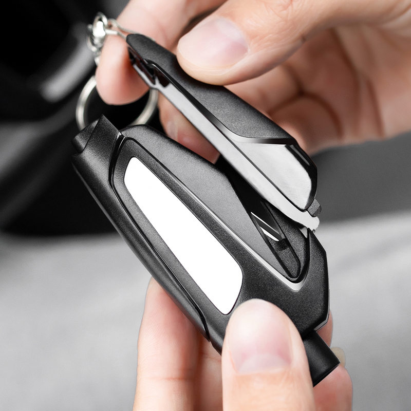 A second broken window car with a broken window and an underwater escape theorizer safety hammer with in-car supplies