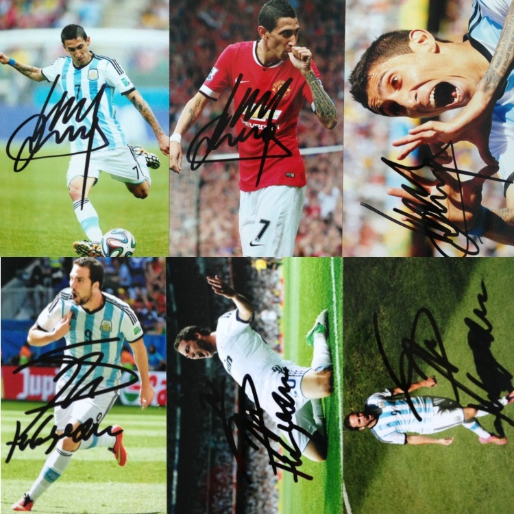 Dimaria Iguain with a photo of Messi Romero Aquilo Martino Photos