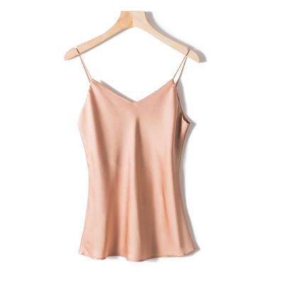 A female summer dress with a silk-like fine halter top wears a silk satin top on the outside and a V-neck, seamless halter top inside