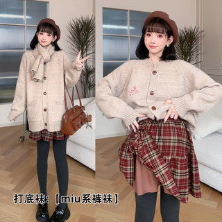 Nana’s three-piece sweater and skirt set during pregnancy