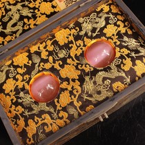 Collection of a pair of precious and rare pink cats eye stones used by the old palace and an old lacquerware box