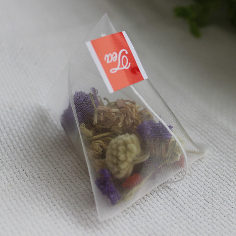 Food grade 100 tablets 5.8 * 7 heat seal nylon disposable tea bag triangle three-dimensional filter bag flower tea bubble bag