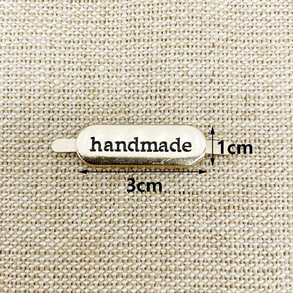 如何挑选适合自己的现货服装Handmade插脚金属标标签?