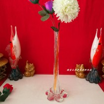 Old vase plugged in 1980s with fluttering glass bottles like a pipe rose bottle table decorated movie props