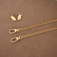 2 пряжки светлого золота + цепочка длиной 120 см.