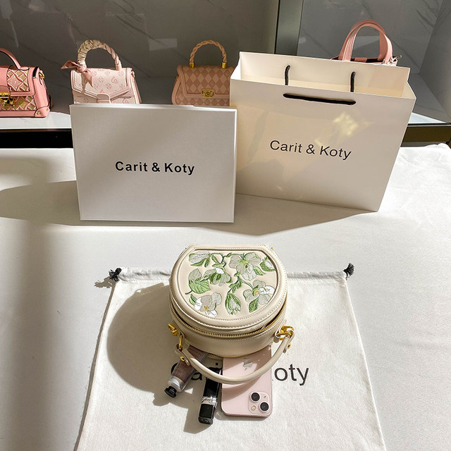 CaritKoty high-end embroidered small round bag 2023 spring new commuter niche handbag female Messenger