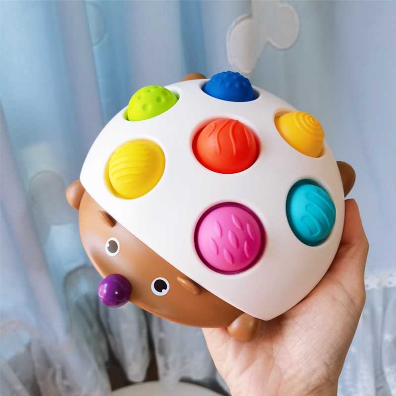 Hedgehog appeasement of bubble and infant 7-coloured hand grip pressing plate Exercise Baby fine action finger Toy