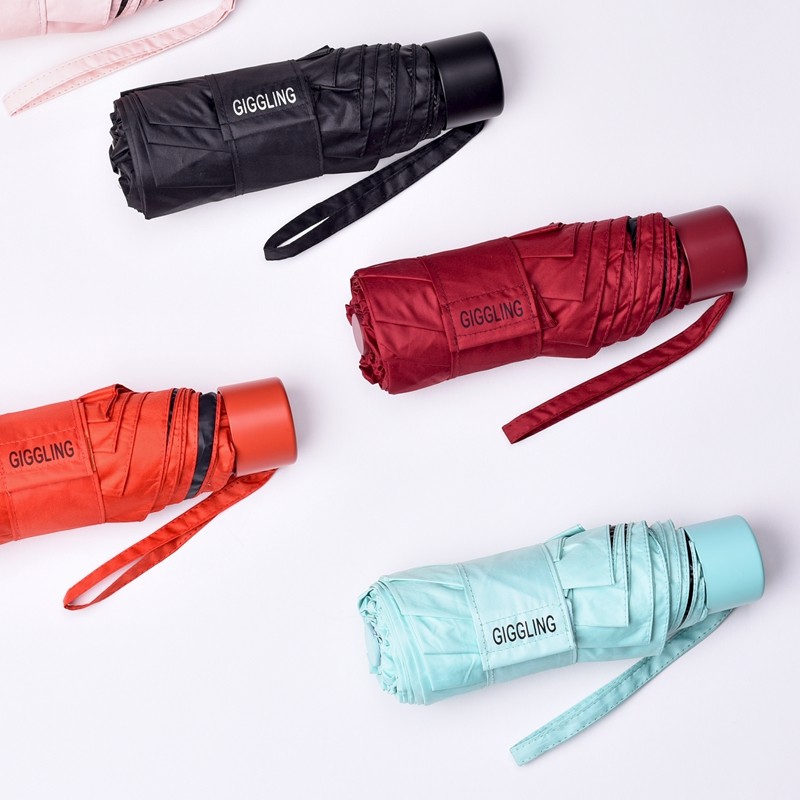 Giggling ultra light 8 bone capsule sun protection UV shade male and female barometer with black glue five folded parasol