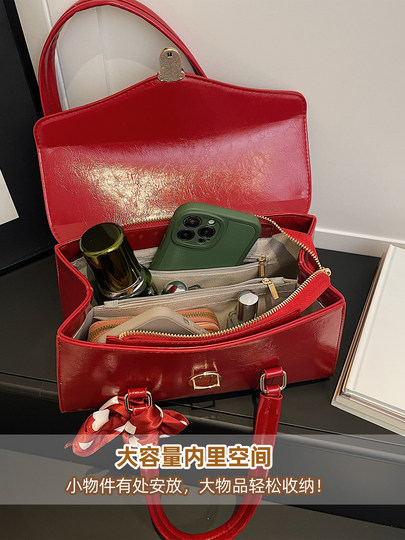 This year's hottest red baguette wedding bag for women 2026 new winter high-end light luxury niche shoulder bag for women