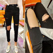 Thin European station fashion elastic pure black hole nine-point jeans female foreign style knee hole small foot