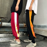 Phiên bản Hàn Quốc của mùa xuân mới phong cách Harajuku nam và nữ chân chùm quần harem màu sắc phù hợp với ngọn lửa in quần lỏng lẻo thủy triều