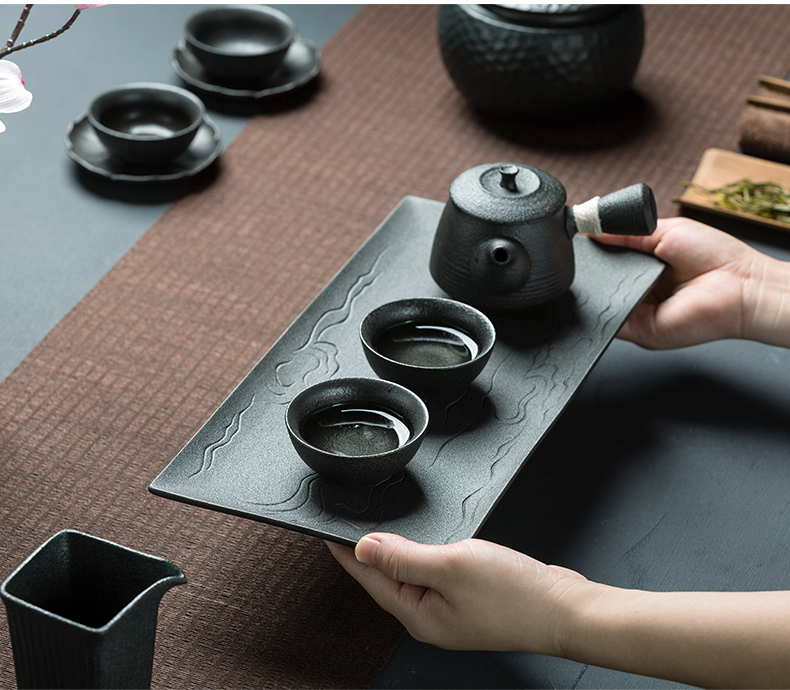 A pot of black pottery stem four cups of tea set office home zen tea tray cup teapot creative kung fu tea set