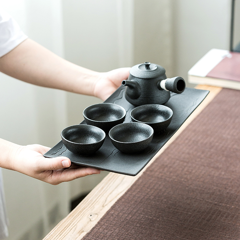 A pot of black pottery stem four cups of tea set office home zen tea tray cup teapot creative kung fu tea set