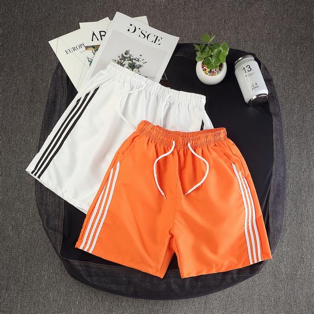 Quần short thể thao nam mùa hè quần lửng 3 ba rưỡi quần lớn Quần nam nửa chân đi biển quần trắng 9,9 quần áo nam