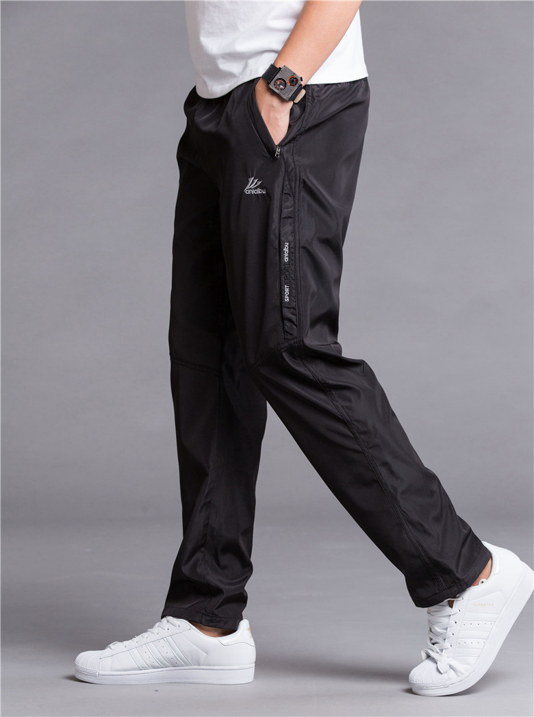 Mùa đông cộng với quần nhung dày thường xuyên quần tây nam quần polyester thoáng khí nhanh khô quần chống gió mùa xuân và mùa thu quần lỏng shop quần áo nam