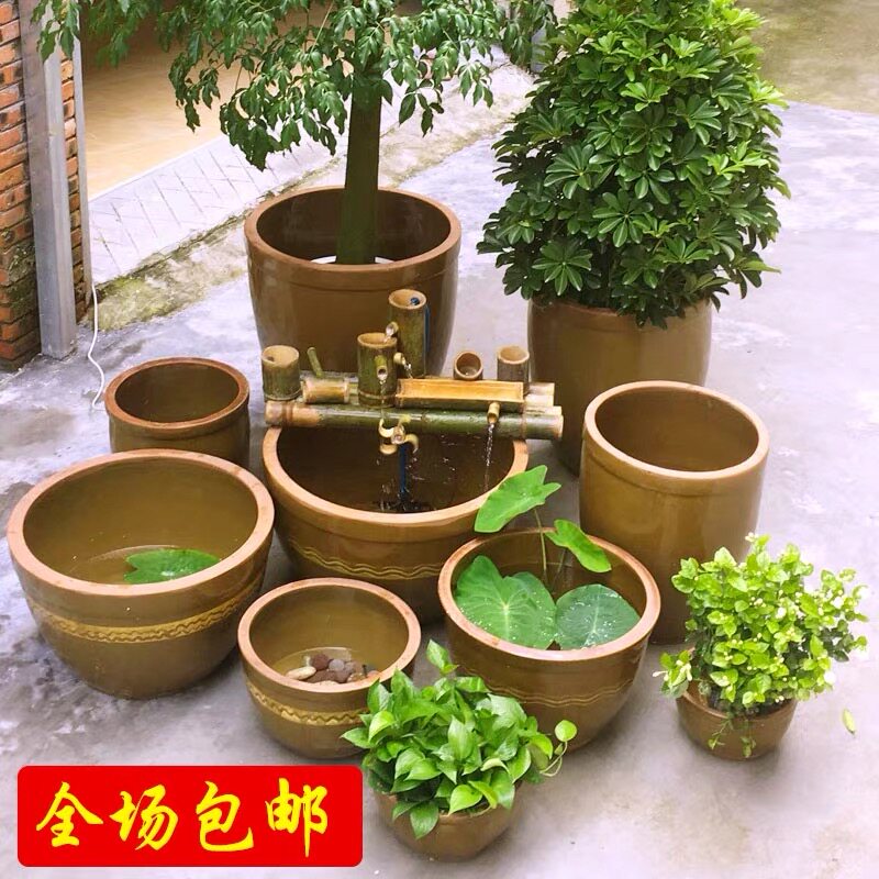 Water tank Ceramic large household running water fish Garden nap Lotus Lotus Old pickle earth pottery jar Coarse pottery landscaping