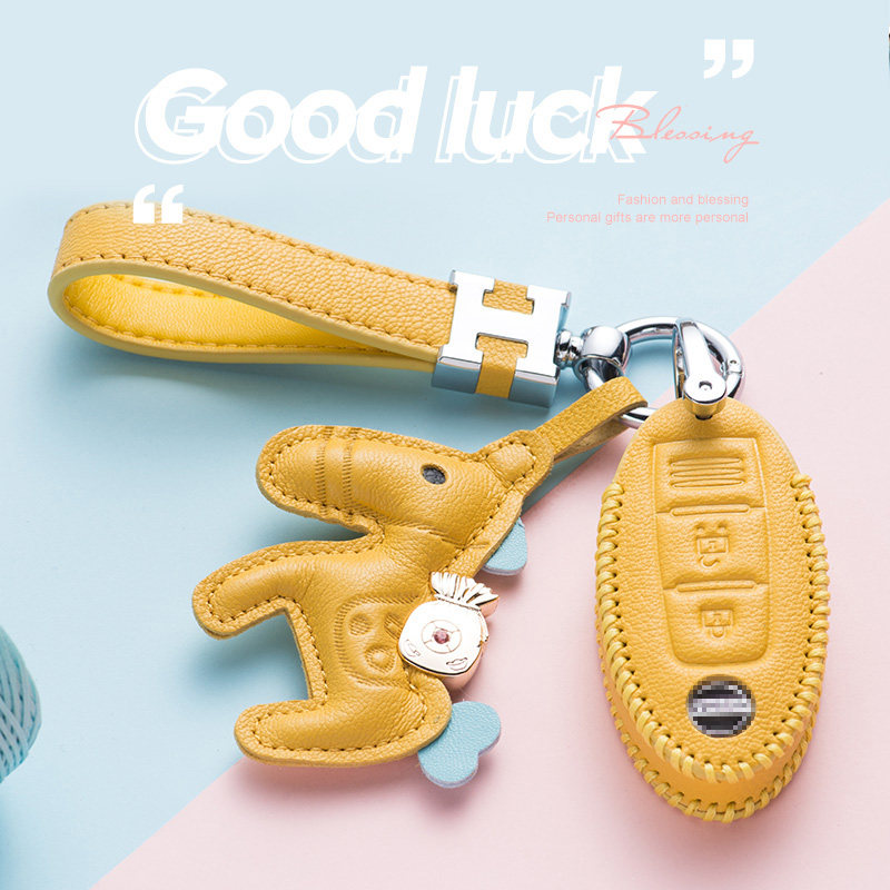 Suitable for Nissan Qijun key cover Xuanyi high-end shell Jinke bag 21 leather Tiida women's new Qashqai buckle