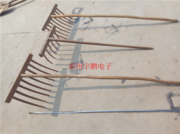 Old wooden rake, old farm tool, wooden fork, museum decoration, film and television props, folk custom, old object, nostalgic leisure farm decoration