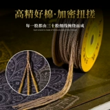 Тибетская рука втирает хлопчатобумаж