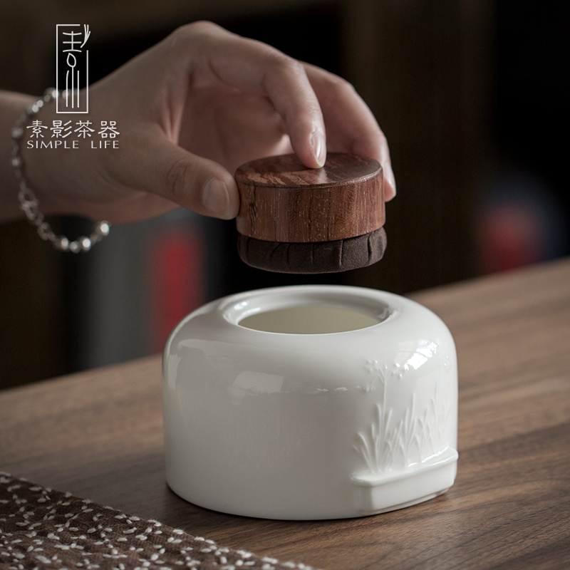 Plain film dehua white porcelain tea pot suet jade porcelain anaglyph ebony cover household ceramic tea storehouse wake tea boxes