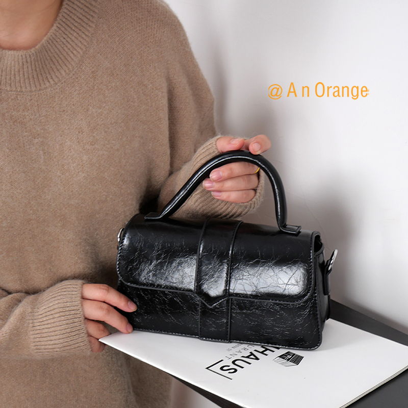 An Orange Women's Bag with a High-End Oil Wax Leather Glossy Finish, Small Square Crossbody Bag, Vintage Shoulder Bag, Simple Korean-Style Handbag